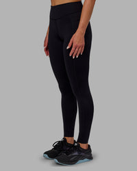 Woman wearing Elite High-Rise Full Length Legging Pockets - Black | Thumbnail Index: 5