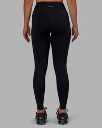 Woman wearing Elite High-Rise Full Length Legging Pockets - Black | Thumbnail Index: 3