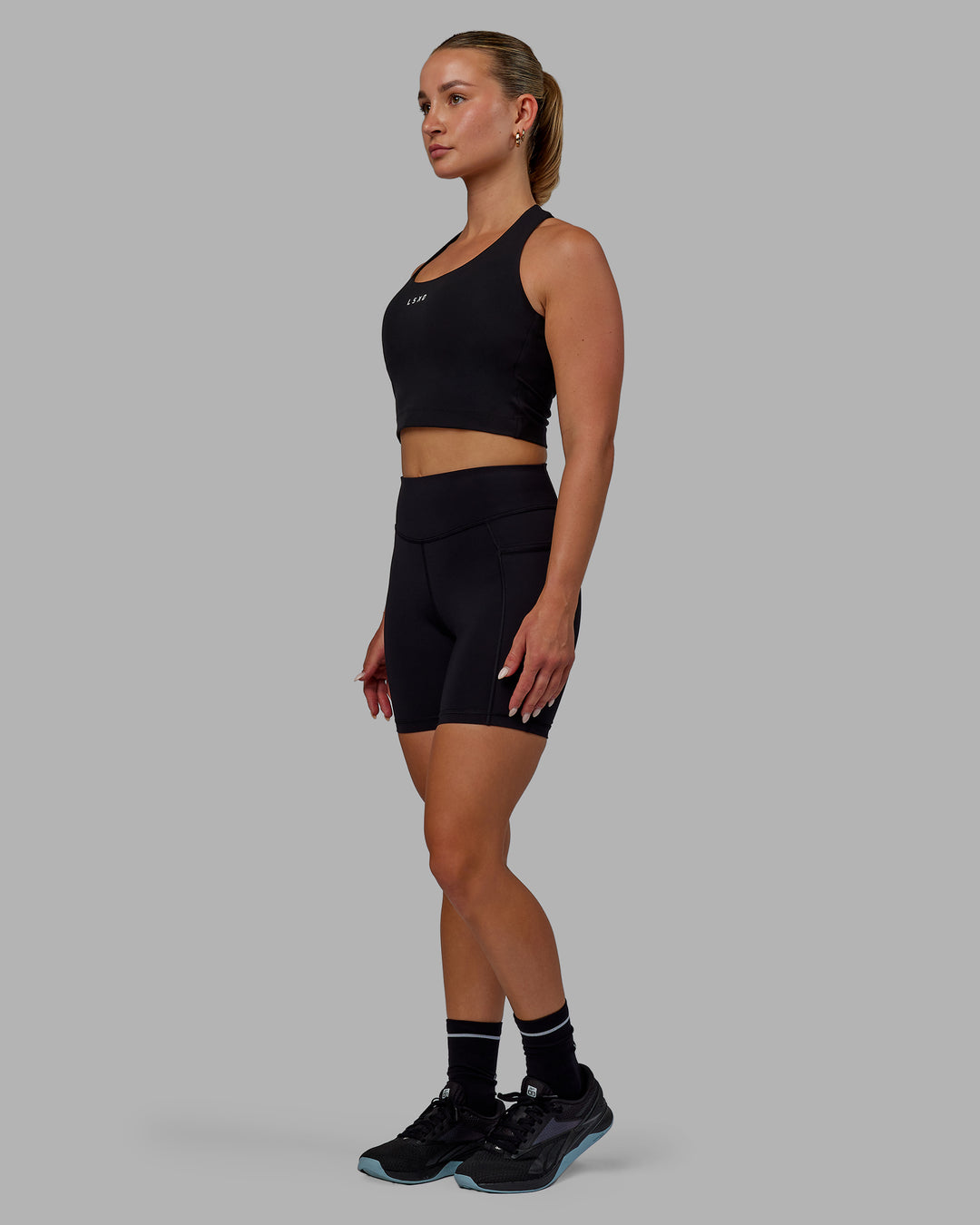 Woman wearing Elite High-Rise 6" Short Pockets - Black - view 5