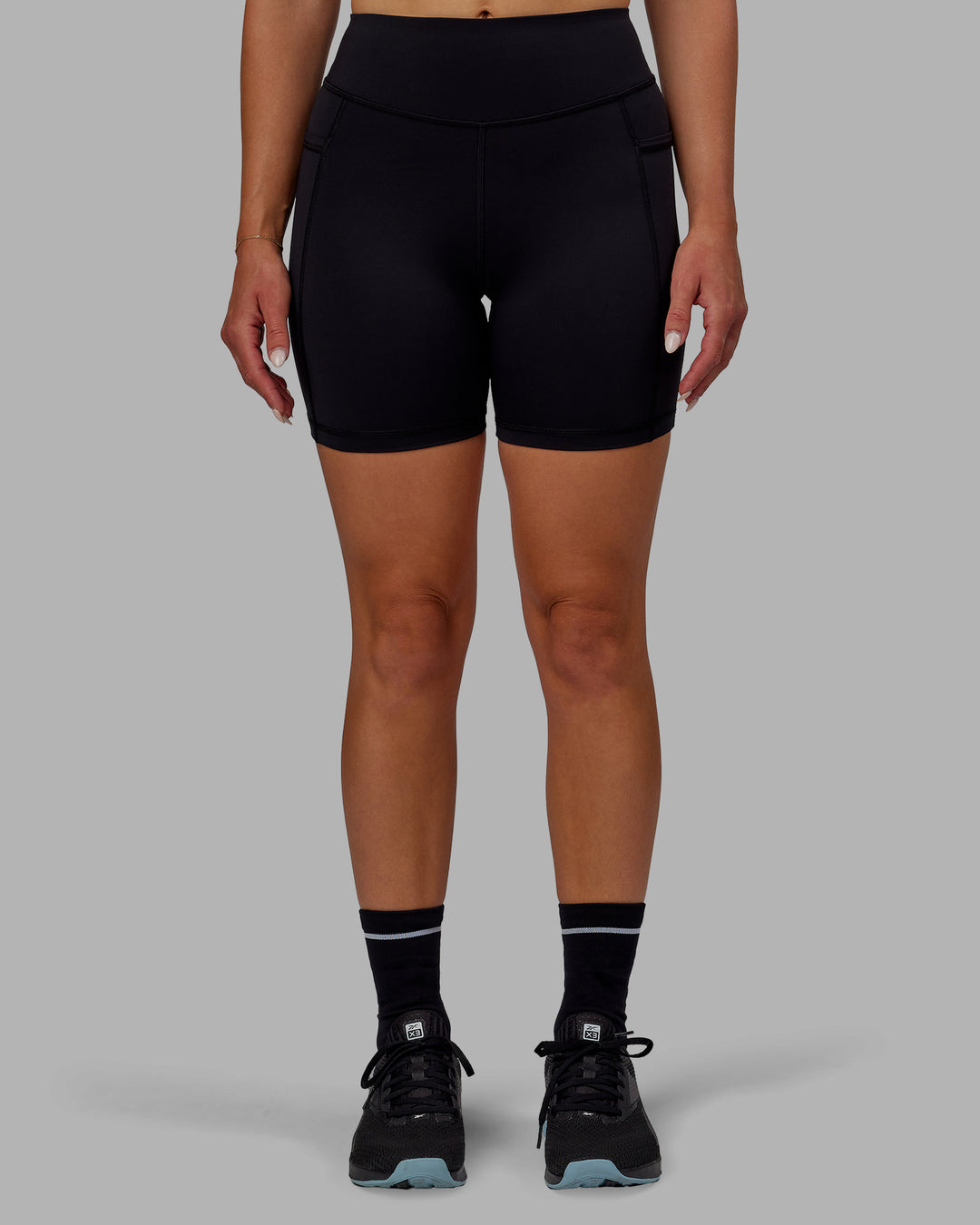 Woman wearing Elite High-Rise 6" Short Pockets - Black - view 10