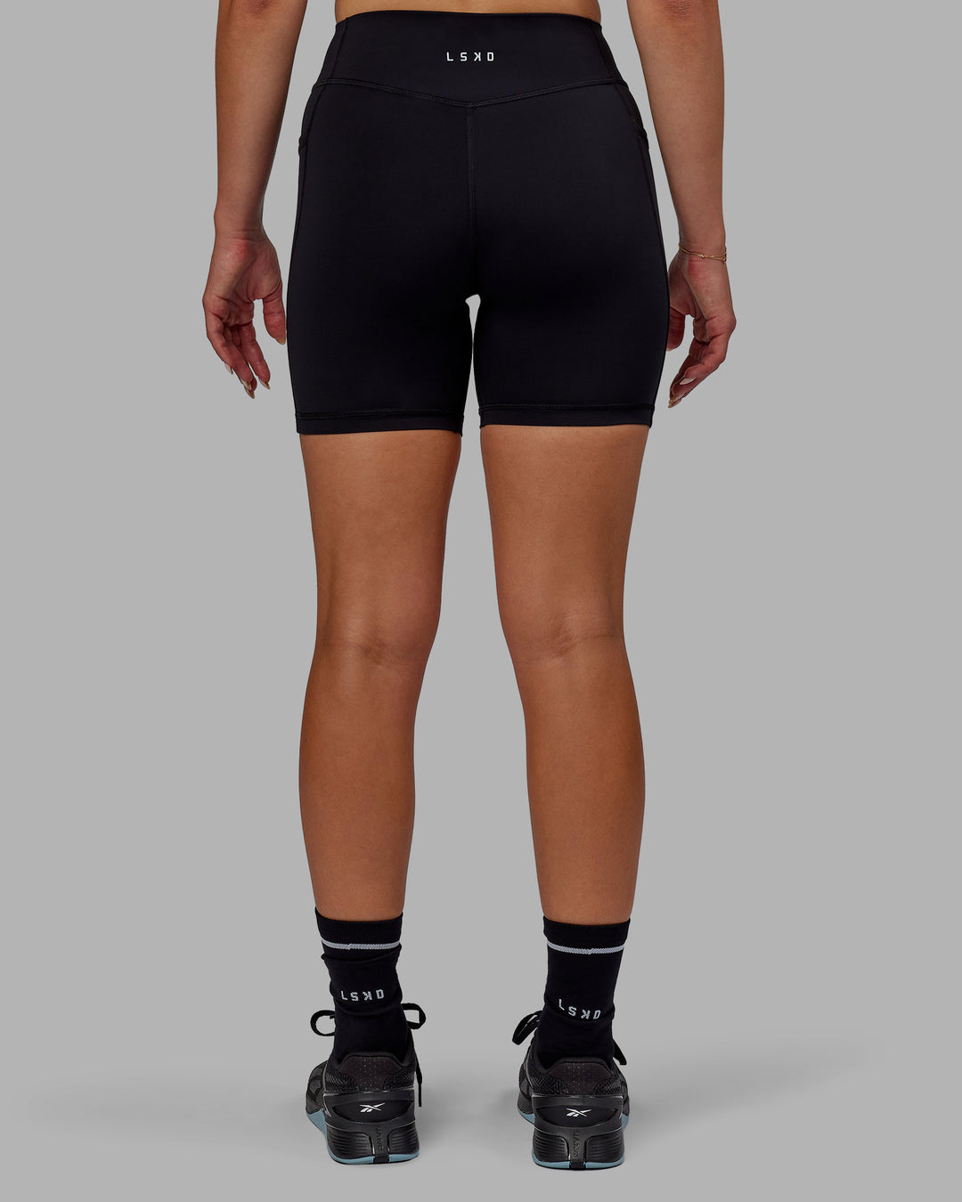 Woman wearing Elite High-Rise 6" Short Pockets - Black - view 4