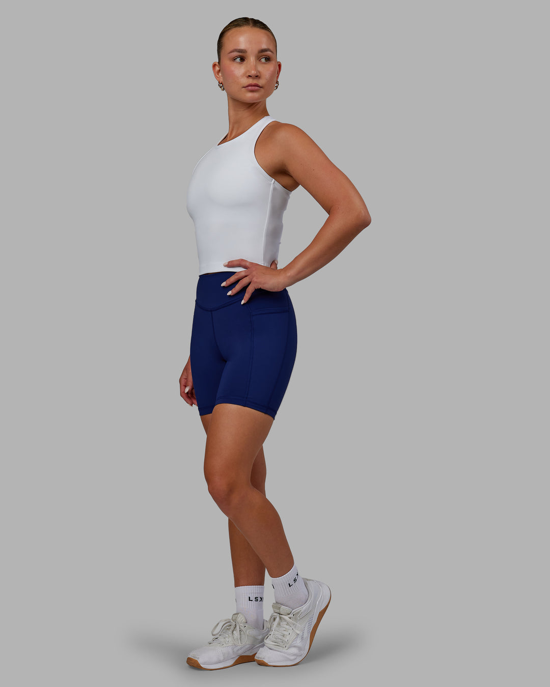 Woman wearing Elite High-Rise 6" Short Pockets - Midnight Blue - view 4