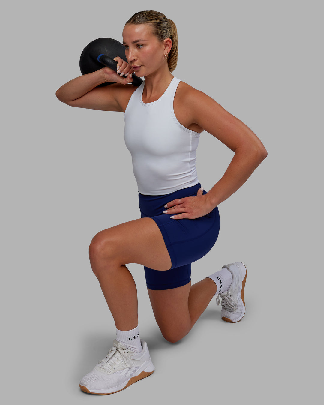 Woman wearing Elite High-Rise 6" Short Pockets - Midnight Blue - view 9