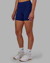 Woman wearing Elite High-Rise 4" Short Pockets - Midnight Blue | Thumbnail Index: 3