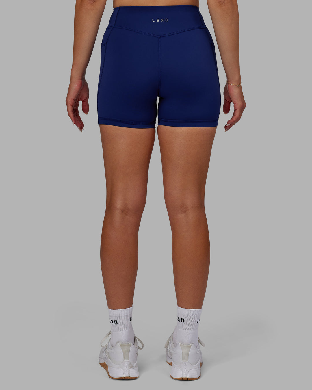 Woman wearing Elite High-Rise 4" Short Pockets - Midnight Blue - view 3