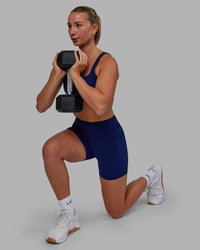 Woman wearing Elite High-Rise 4" Short Pockets - Midnight Blue | Thumbnail Index: 5
