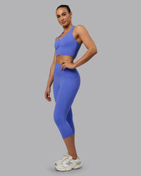 Woman wearing Elixir Ultra High-Rise 3/4 Legging Pockets - Baja Blue | Model:Sophie | Size:S | Thumbnail Index: 2