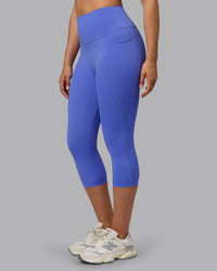 Woman wearing Elixir Ultra High-Rise 3/4 Legging Pockets - Baja Blue | Model:Sophie | Size:S | Thumbnail Index: 6