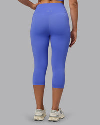 Woman wearing Elixir Ultra High-Rise 3/4 Legging Pockets - Baja Blue | Model:Sophie | Size:S | Thumbnail Index: 3