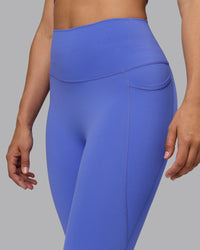 Woman wearing Elixir Ultra High-Rise 3/4 Legging Pockets - Baja Blue | Model:Sophie | Size:S | Thumbnail Index: 5