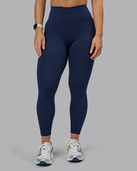 Woman wearing Elixir Ultra High-Rise 7/8 Legging - Future Navy | Model:Lyss | Size:S | Thumbnail Index: 1