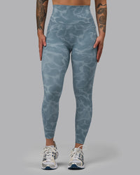 Woman wearing Elixir Ultra High-Rise 7/8 Legging Pockets - Tranquil-Elemental Blue | Model:Robyn | Size:S | Thumbnail Index: 4