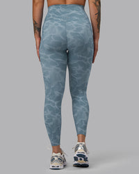 Woman wearing Elixir Ultra High-Rise 7/8 Legging Pockets - Tranquil-Elemental Blue | Model:Robyn | Size:S | Thumbnail Index: 3