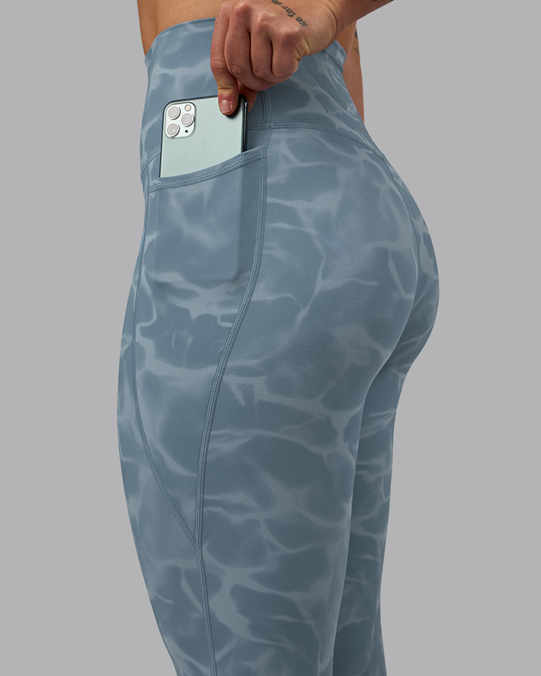 Woman wearing Elixir Ultra High-Rise 7/8 Legging Pockets - Tranquil-Elemental Blue | Model:Robyn | Size:S - view 3