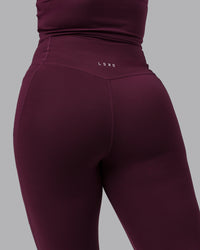 Woman wearing Elixir Ultra High-Rise 7/8 Legging Pockets - Cherry Lacquer | Model:Lyss | Size:S | Thumbnail Index: 8