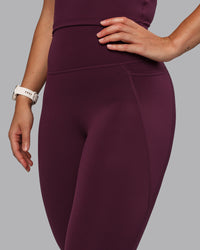 Woman wearing Elixir Ultra High-Rise 7/8 Legging Pockets - Cherry Lacquer | Model:Lyss | Size:S | Thumbnail Index: 6