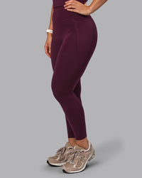 Woman wearing Elixir Ultra High-Rise 7/8 Legging Pockets - Cherry Lacquer | Model:Lyss | Size:S | Thumbnail Index: 0