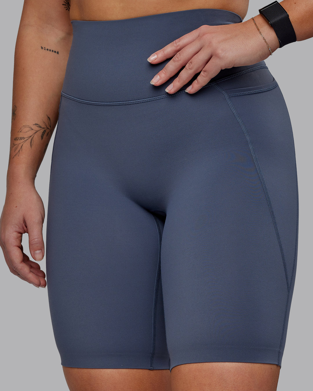 Woman wearing Elixir Ultra High-Rise 9" Short Pockets - Turbulence | Model:Suz | Size:S - view 3