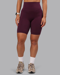 Woman wearing Elixir Ultra High-Rise 9" Short Pockets - Cherry Lacquer | Model:Lyss | Size:S | Thumbnail Index: 1