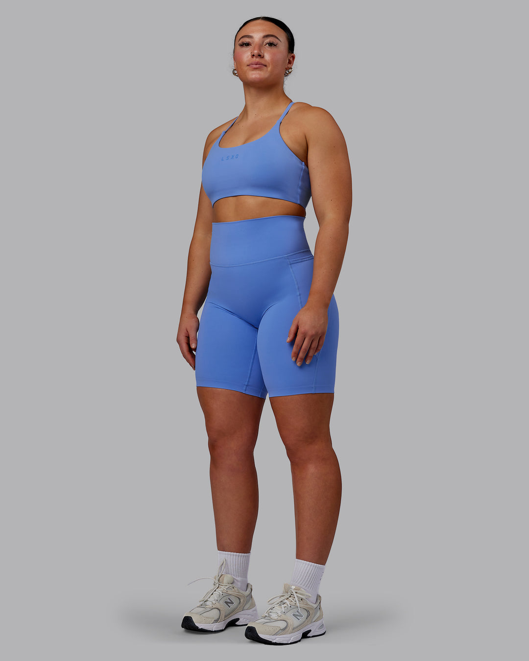 Woman wearing Elixir Ultra High-Rise 9" Short Pockets - Ultramarine | Model:Bronty | Size:M - view 6