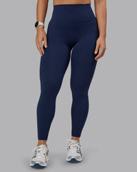 Woman wearing Elixir Ultra High-Rise Full Length Legging - Future Navy | Thumbnail Index: 0