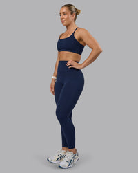 Woman wearing Elixir Ultra High-Rise Full Length Legging - Future Navy | Thumbnail Index: 1
