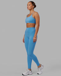 Woman wearing Elixir Ultra High-Rise Full Length Legging Pockets - Azure Blue | Thumbnail Index: 4