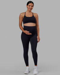 Woman wearing Elixir Ultra High-Rise Maternity Full Length Legging - Black | Model:Amanda | Size:S | Thumbnail Index: 8