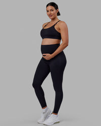 Woman wearing Elixir Ultra High-Rise Maternity Full Length Legging - Black | Model:Amanda | Size:S | Thumbnail Index: 3