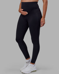 Woman wearing Elixir Ultra High-Rise Maternity Full Length Legging - Black | Model:Amanda | Size:S | Thumbnail Index: 7