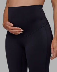 Woman wearing Elixir Ultra High-Rise Maternity Full Length Legging - Black | Model:Amanda | Size:S | Thumbnail Index: 6