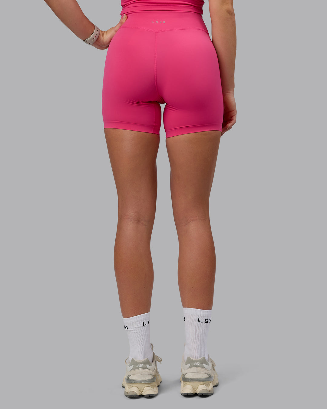 Woman wearing Elixir Ultra High-Rise 6" Short - Pink Flash - view 4