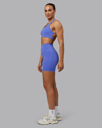 Woman wearing Elixir Ultra High-Rise 6" Short Pockets - Baja Blue | Thumbnail Index: 4