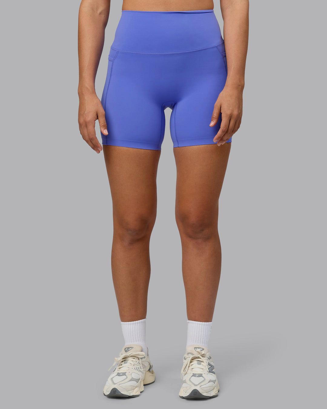 Woman wearing Elixir Ultra High-Rise 6" Short Pockets - Baja Blue - view 3
