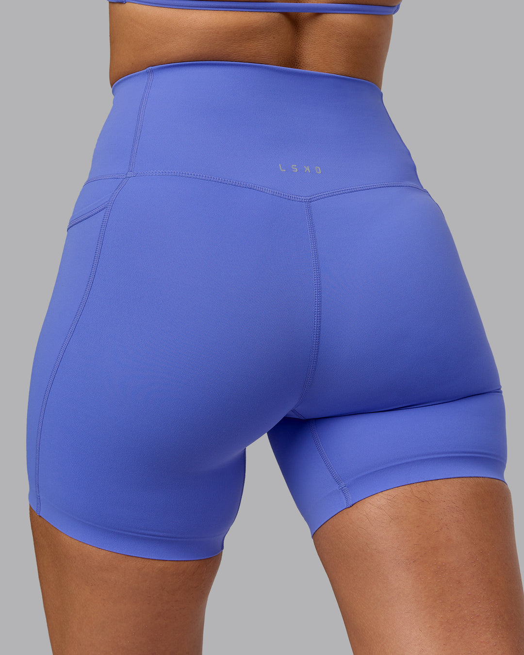 Woman wearing Elixir Ultra High-Rise 6" Short Pockets - Baja Blue - view 7