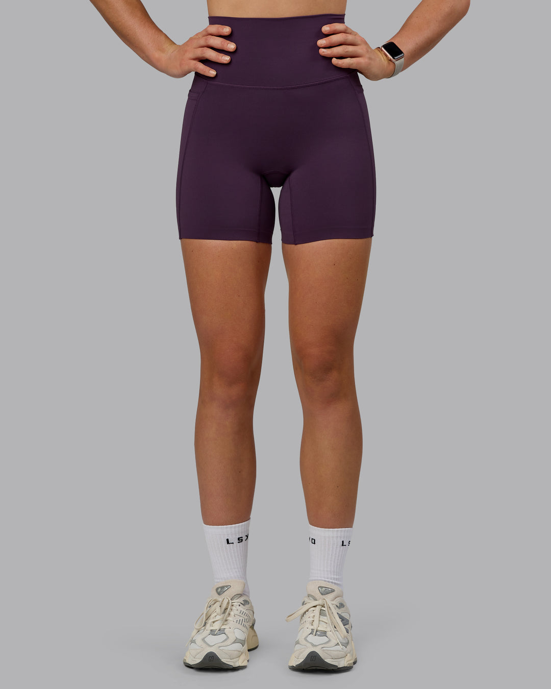 Woman wearing Elixir Ultra High-Rise 6" Short Pockets - Midnight Plum - view 1