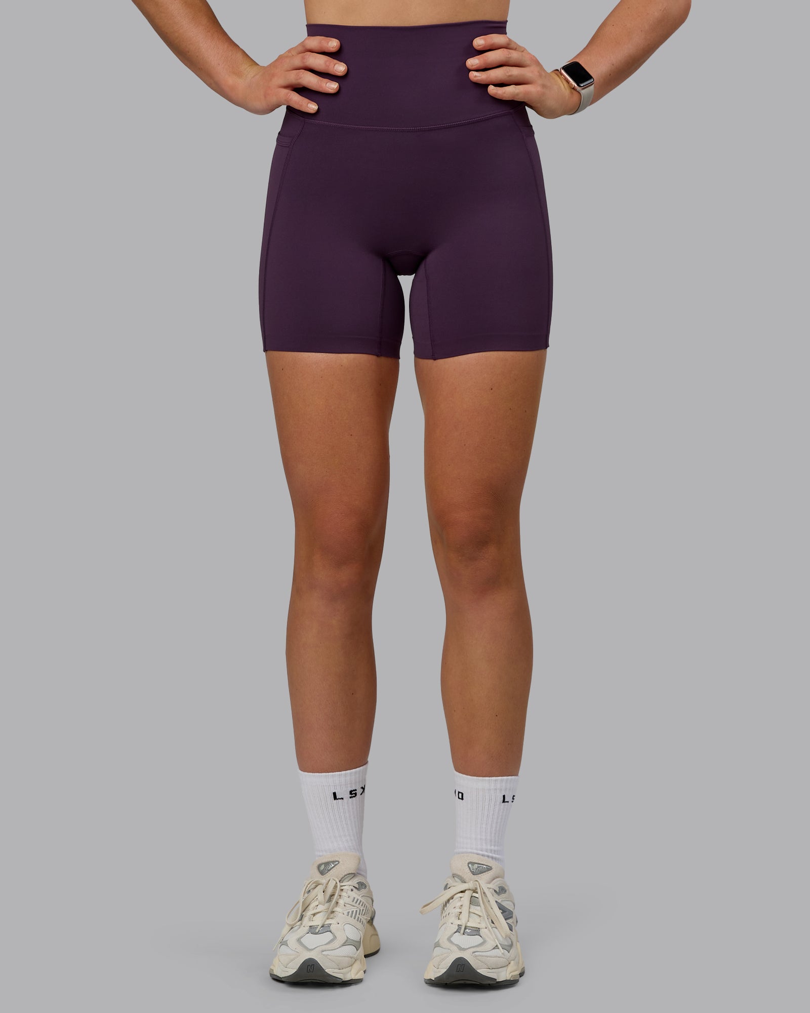 Woman wearing Elixir Ultra High-Rise 6" Short Pockets - Midnight Plum
