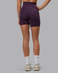 Woman wearing Elixir Ultra High-Rise 6" Short Pockets - Midnight Plum | Thumbnail Index: 3