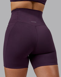 Woman wearing Elixir Ultra High-Rise 6" Short Pockets - Midnight Plum | Thumbnail Index: 8