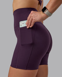 Woman wearing Elixir Ultra High-Rise 6" Short Pockets - Midnight Plum | Thumbnail Index: 2