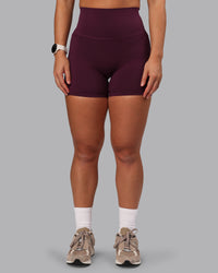 Woman wearing Elixir Ultra High-Rise 6" Short Pockets - Cherry Lacquer | Thumbnail Index: 5
