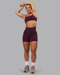 Woman wearing Elixir Ultra High-Rise 6" Short Pockets - Cherry Lacquer | Thumbnail Index: 1