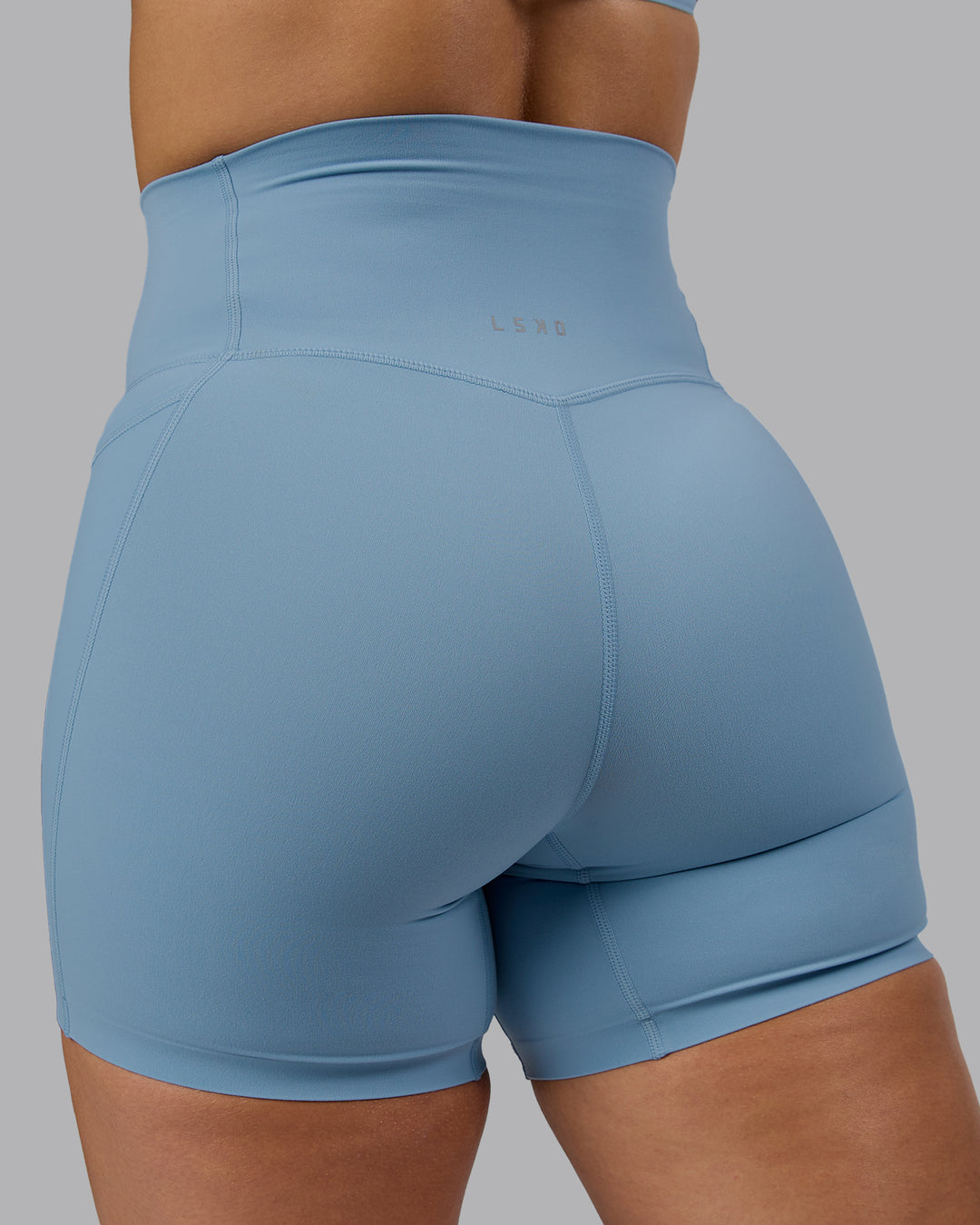 Woman wearing Elixir Ultra High-Rise 6" Short Pockets - Glacier Lake - view 8