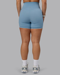 Woman wearing Elixir Ultra High-Rise 6" Short Pockets - Glacier Lake | Thumbnail Index: 3
