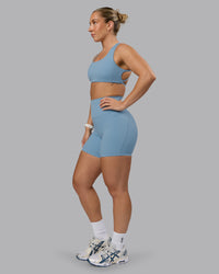 Woman wearing Elixir Ultra High-Rise 6" Short Pockets - Glacier Lake | Thumbnail Index: 5
