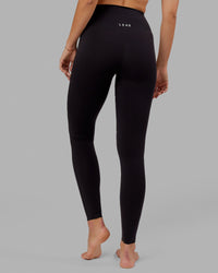 Woman wearing Elixir Ultra High-Rise Tall Legging - Black | Thumbnail Index: 3