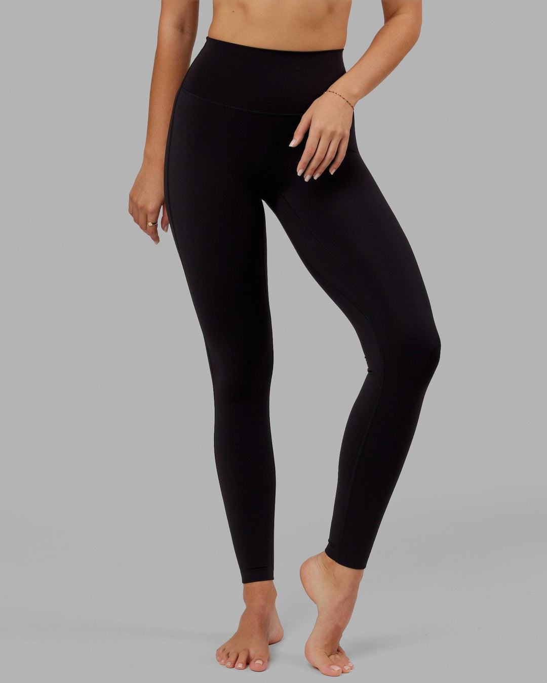Woman wearing Elixir Ultra High-Rise Tall Legging - Black - view 7