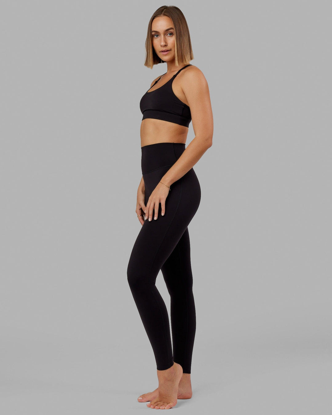 Woman wearing Elixir Ultra High-Rise Tall Legging - Black - view 5