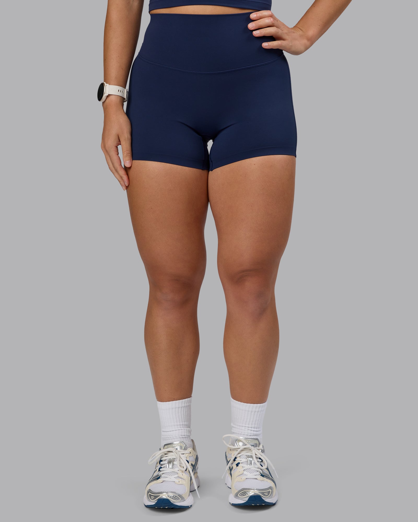 Woman wearing Elixir Ultra High-Rise 4" Short - Future Navy | Model:Lyss | Size:S