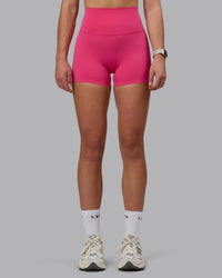 Woman wearing Elixir Ultra High-Rise 4" Short - Pink Flash | Model:Chloe | Size:XS | Thumbnail Index: 5